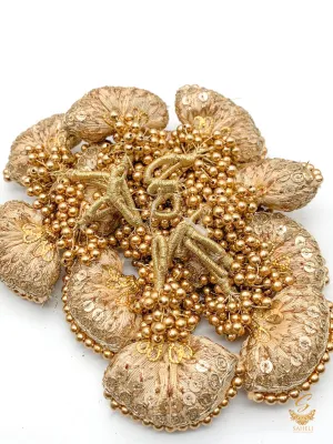 Golden colour cushioned latkan with handwork and moti bunch work (PER PAIR)